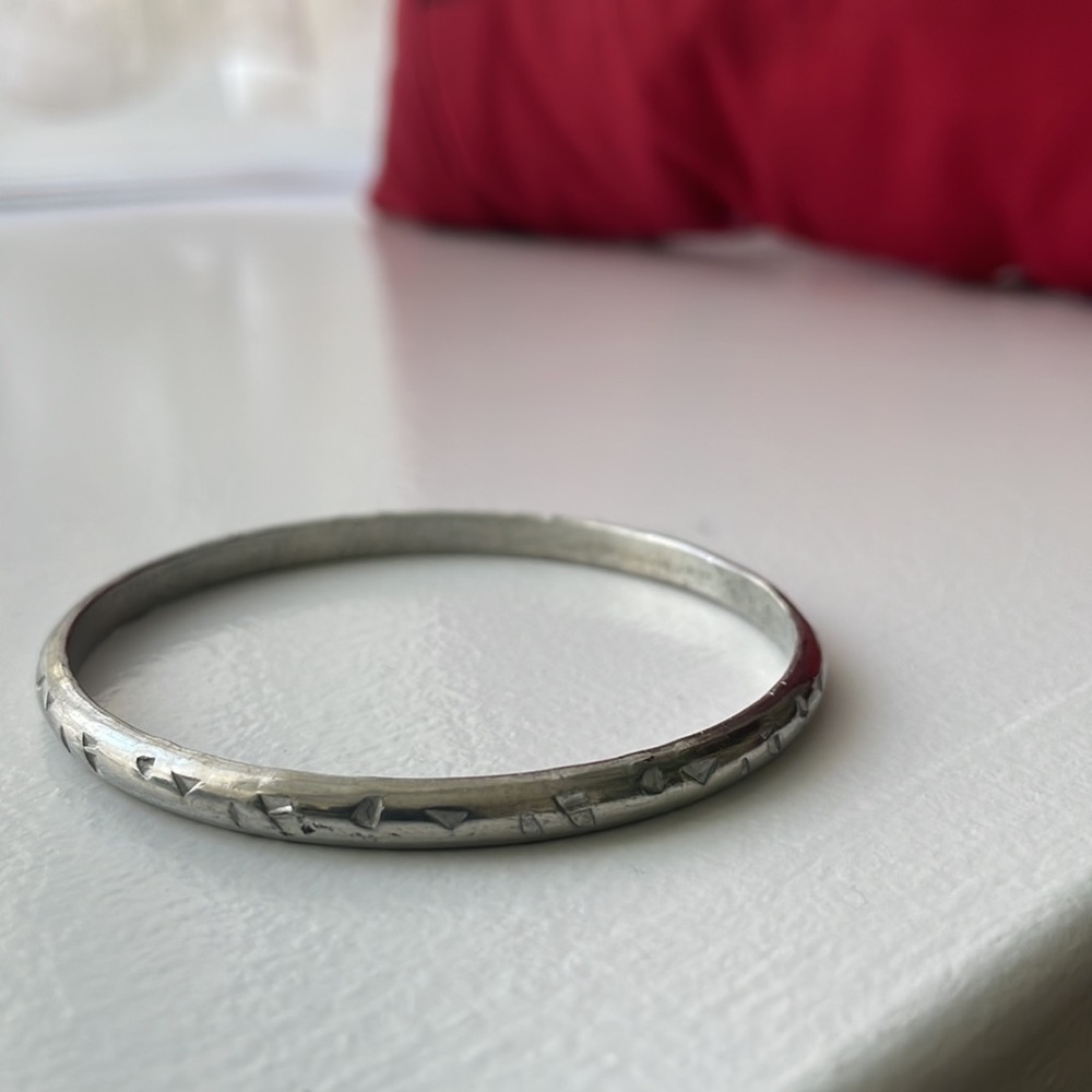 Vintage silver bracelet/ bangle with abstract imprinted design.